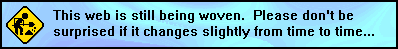 the words 'This web is still being woven. Please don't be suprised if it changes from time to time(dot dot dot)' on a blue background. on the left there is a png of a black and yellow street sign of a simple figure shoveling dirt